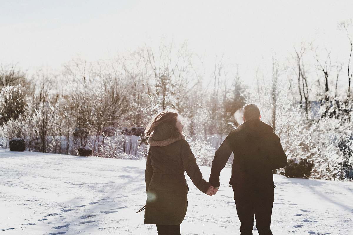 holding hands couple holding hand while walking on snow covered field human